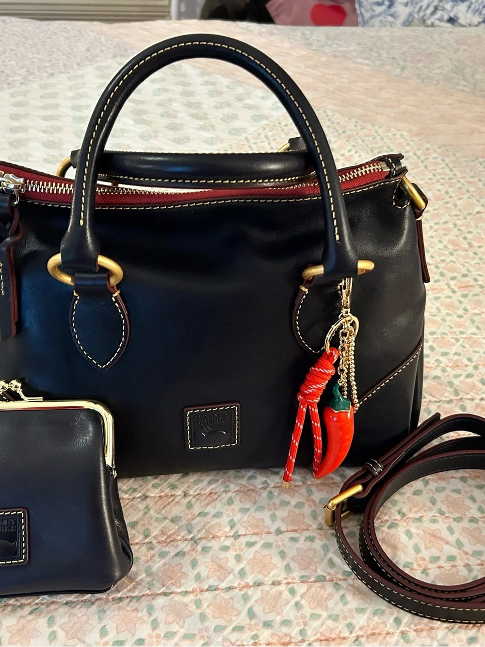 Dooney and Bourke Florentine Satchel 30 in the color Navy. EUC comes w/bag charm